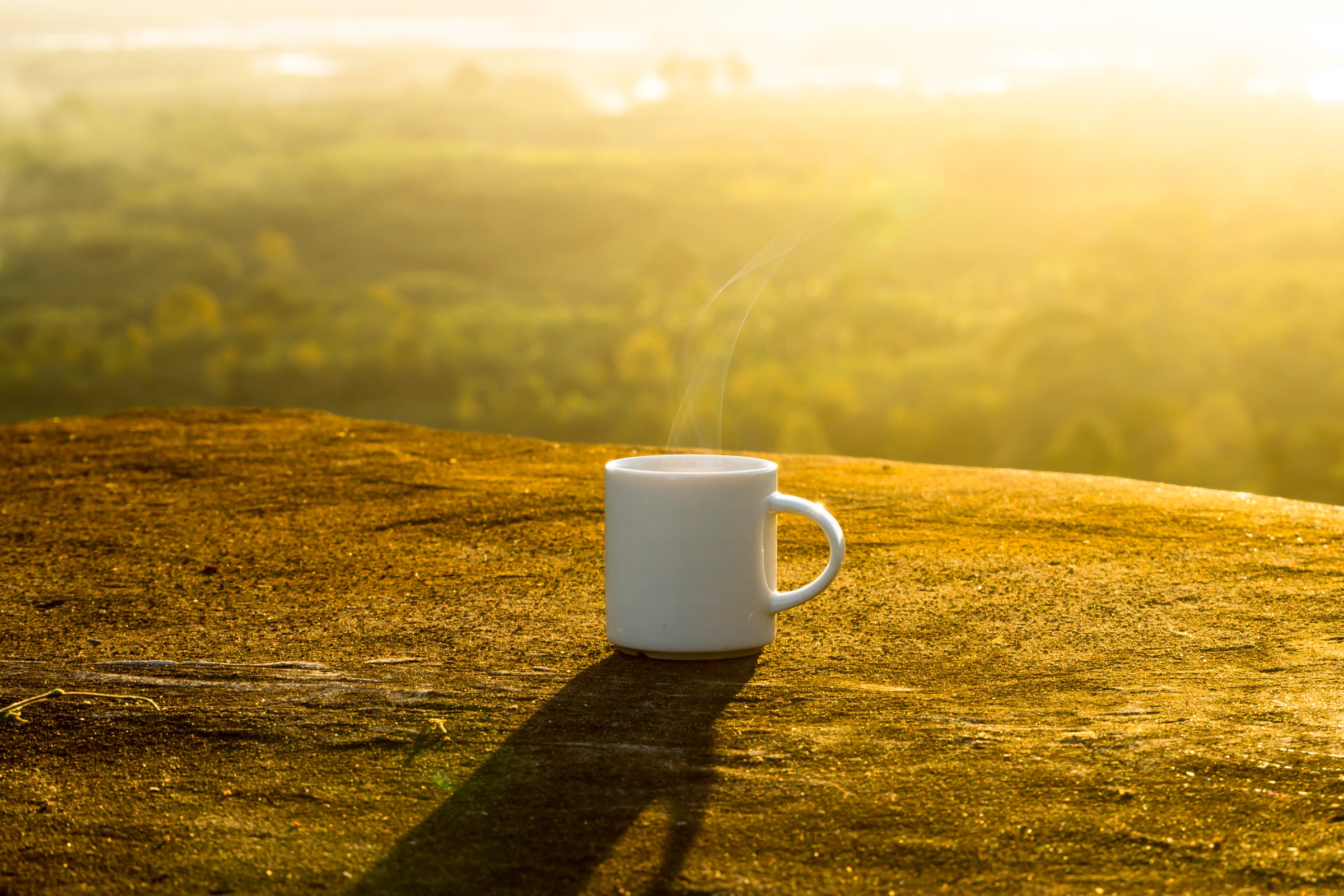 2400-white-coffee-cup-with-sunset-time.jpg